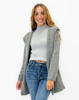 Cardigan morbido con cappuccio tinta unita