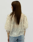 Camicia in chiffon a pois con maniche a sbuffo