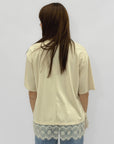 T-shirt over con inserto in pizzo sul fondo