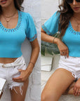 Maglia con decorazioni gioielli