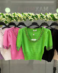 Maglia con decorazioni gioielli