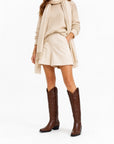 Stivali texani donna Rodeo marroni indossati con outfit autunnale