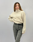 Maglione dolcevita con intrecci