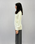 Pullover dolcevita ampio con gioielli