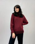 Maglione ampio dolcevita con frange