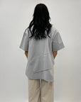 Maglia con dettaglio asimmetrici