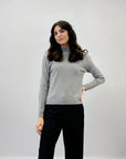 Pullover tinta unita con bottoni laterali