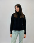 Maglione dolcevita con tre intrecci