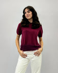 Maglia con piume sul fondo
