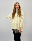 Pullover dolcevita con frange