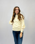 Maglione lupetto con dettagli frange