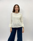 Maglia con perle sulle maniche