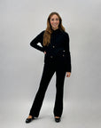 Completo maglia e pantaloni con intrecci