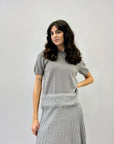 Maglia con piume sul fondo
