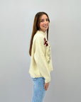 Maglione con scritta believe e fiocchi di neve