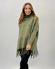 Pullover dolcevita con frange