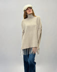 Pullover dolcevita con frange
