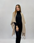 Poncho morbido tinta unita con frange