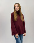 Maglione dolcevita ampio con tasche