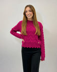 Maglione morbido con intrecci e rotture