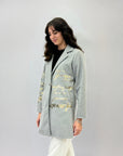 Cappotto in panno con chiusura bottone con scritta