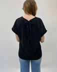 Maglia con strass e sul retro fiocco