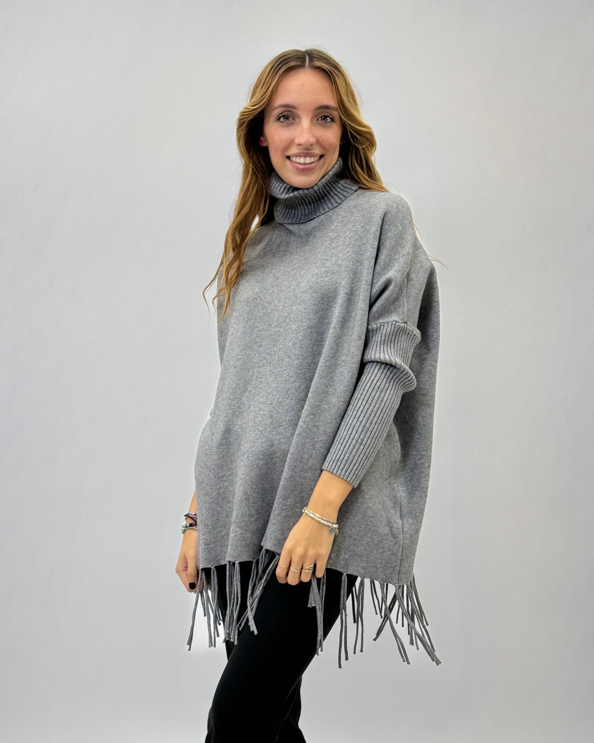 Pullover dolcevita con frange