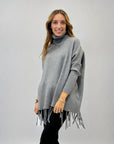 Pullover dolcevita con frange