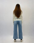 Jeans con bottoni e tasche