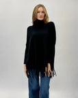 Pullover dolcevita con frange
