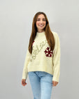 Maglione con scritta believe e fiocchi di neve