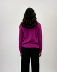 Pullover tinta unita con bottoni laterali