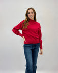 Maglione lupetto con dettagli frange