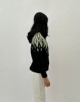 Maglione con cappuccio stampa jacquard
