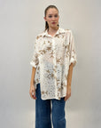 Camicia in pizzo con dettaglio fiori