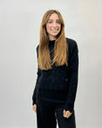Maglione morbido con intrecci e rotture
