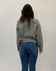 Maglia con zip dettaglio perle