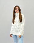 Maglione ampio dolcevita intrecciato