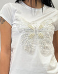T-shirt in cotone con farfalla ricamata gioielli