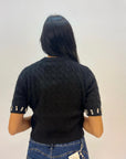 Maglia intrecciata con dettagli gioielli