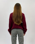 Maglione dolcevita con intrecci