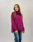 Maglione collo alto con frange