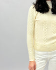 Maglione lupetto con intrecci