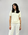 Maglia con piume sul fondo