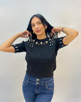Maglia intrecciata con dettagli gioielli