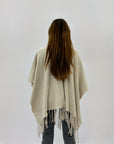 Poncho morbido tinta unita con frange