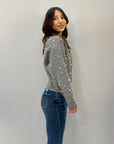 Maglia con zip dettaglio perle