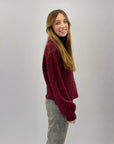 Maglione dolcevita con intrecci