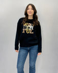 Maglione scritta wonderful in paillettes