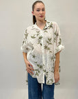 Camicia in pizzo con dettaglio fiori
